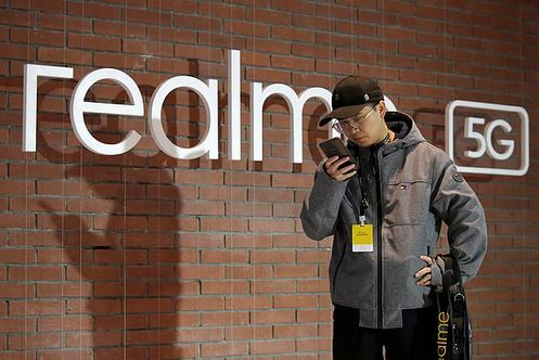 A man holds a Realme phone in Beijing, China. File photo: Reuters